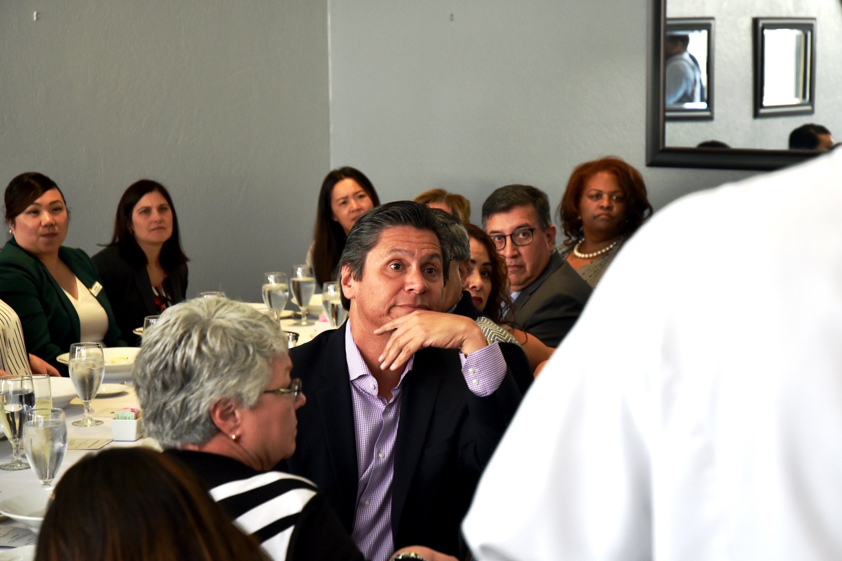 Chancellor Eloy Oakley listens to culinary arts students talk about their hopes and dreams during his visit to the Student Chef at San Joaquin Delta College.