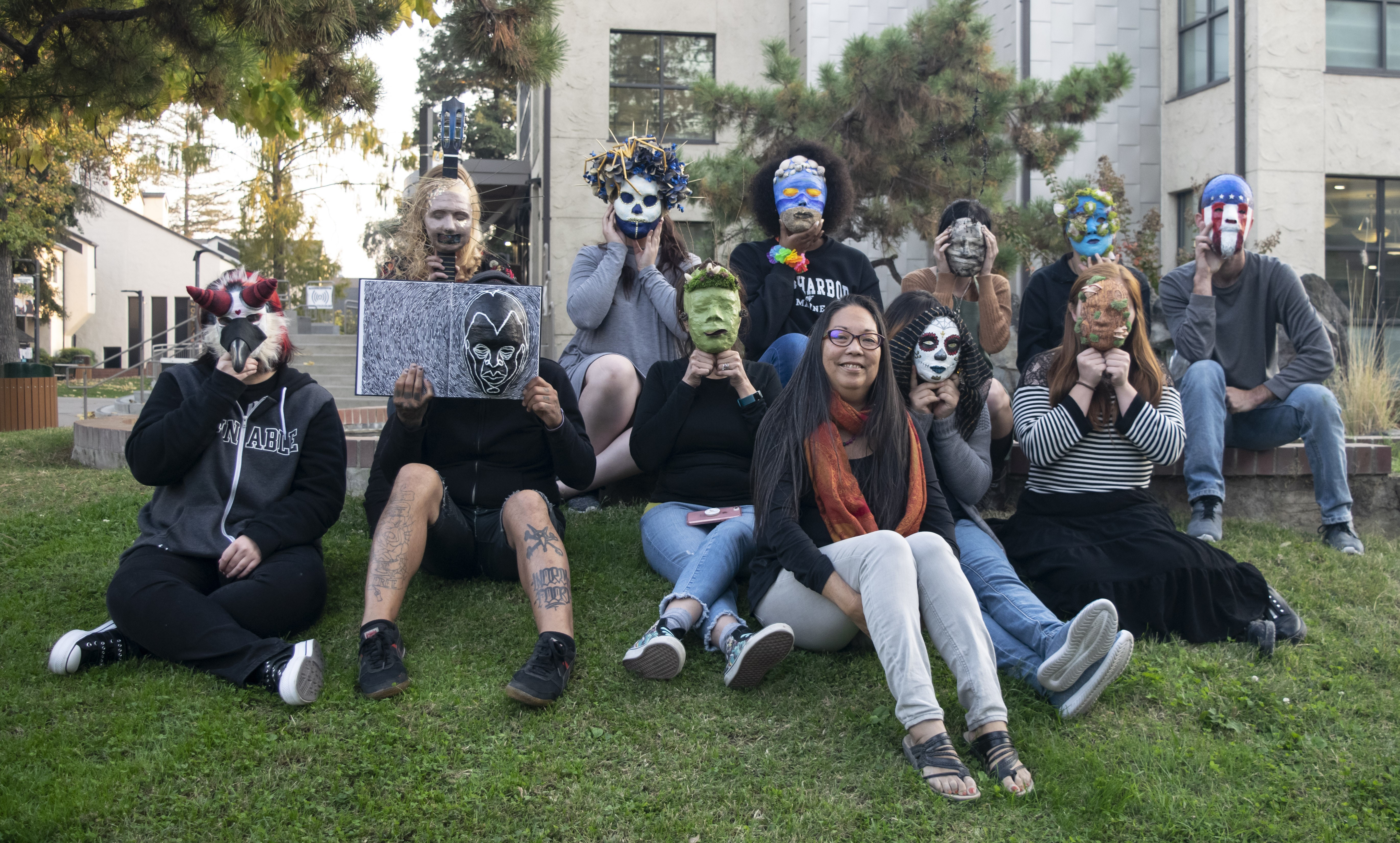 Student artists display their resiliency masks, created with the guidance of San Joaquin Delta College alum Judy Shintani. Photo by Dawn LeAnn.
