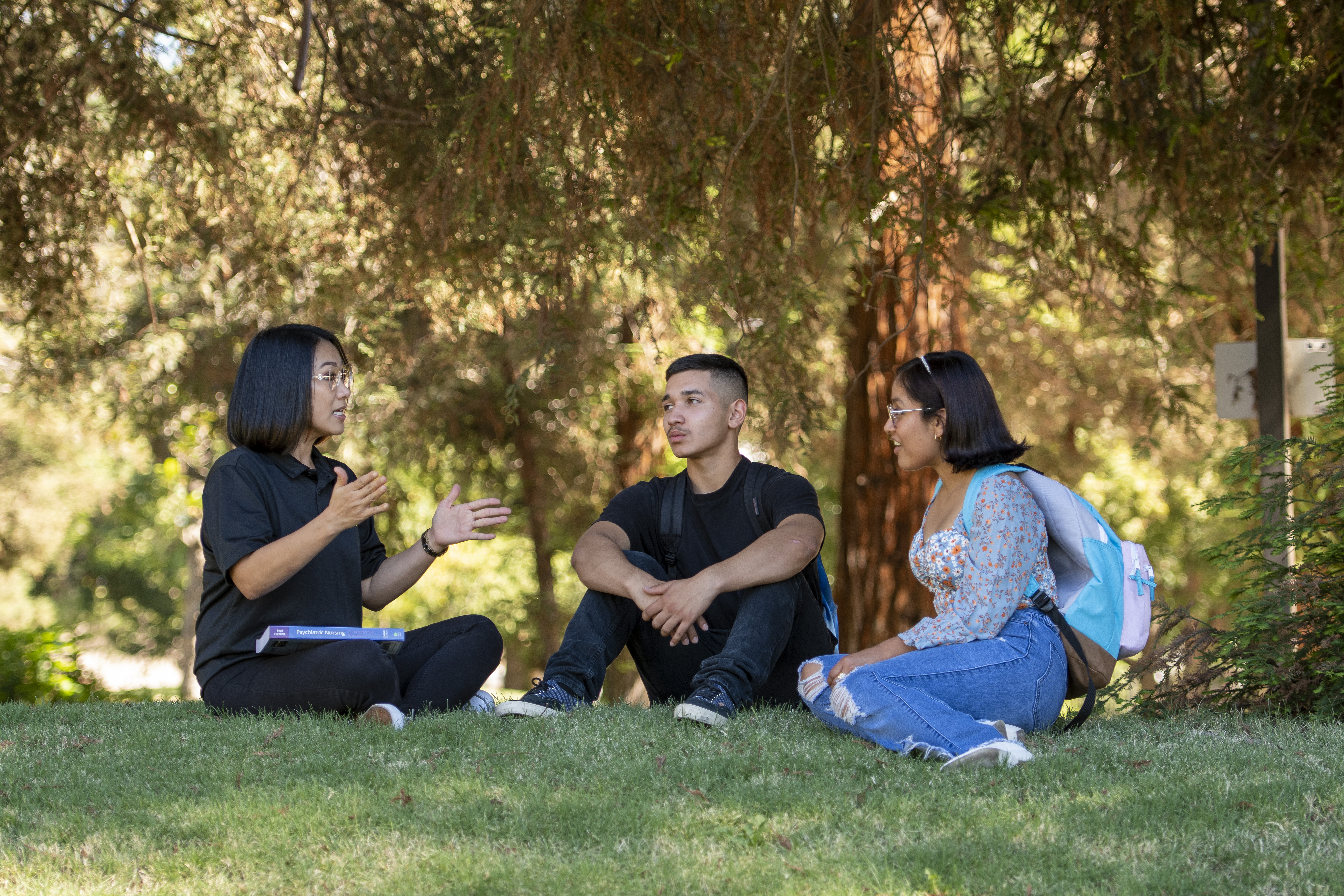 Honey Ong-Licudine chats with other Delta College students