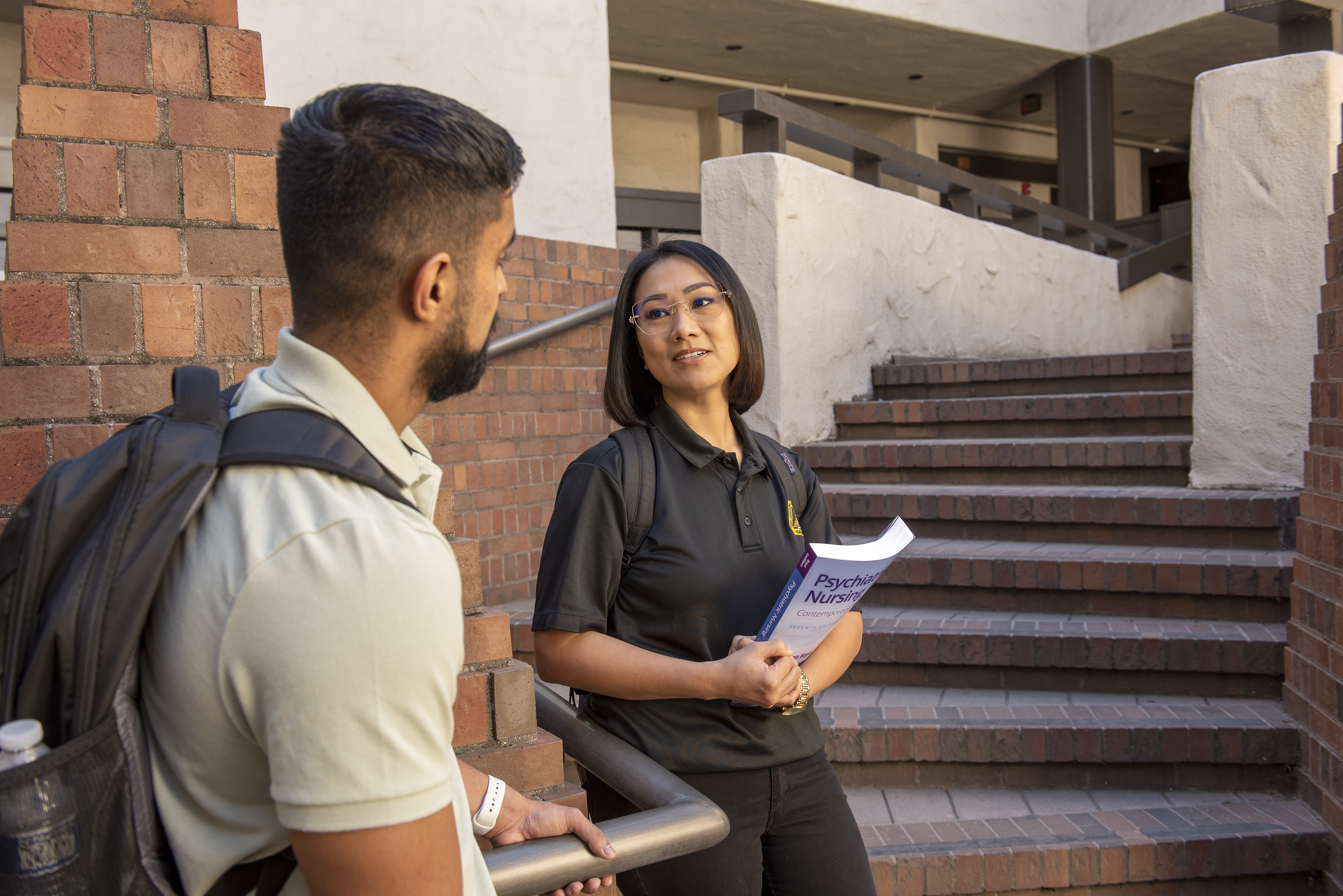 Honey Ong-Licudine chats with anoter Delta College student