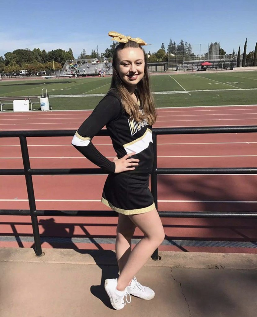 Cheerleader at football game