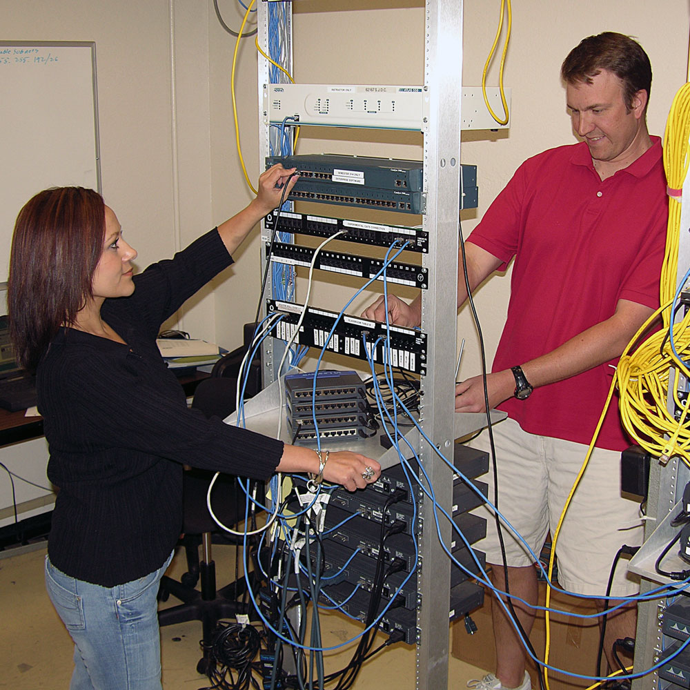 Students work in Cisco networking academy classes