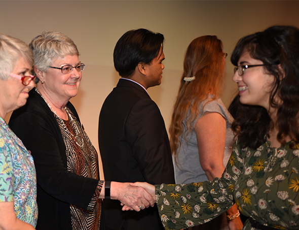 San Joaquin Delta College Superintendent/President Kathy Hart greets a student during the 2017 Scholarship Awards Ceremony.