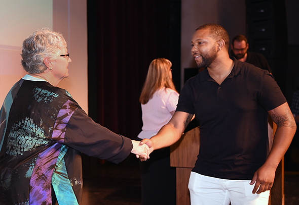 San Joaquin Delta College Superintendent/President Kathy Hart greets a student during a 2016 scholarship awards ceremony.