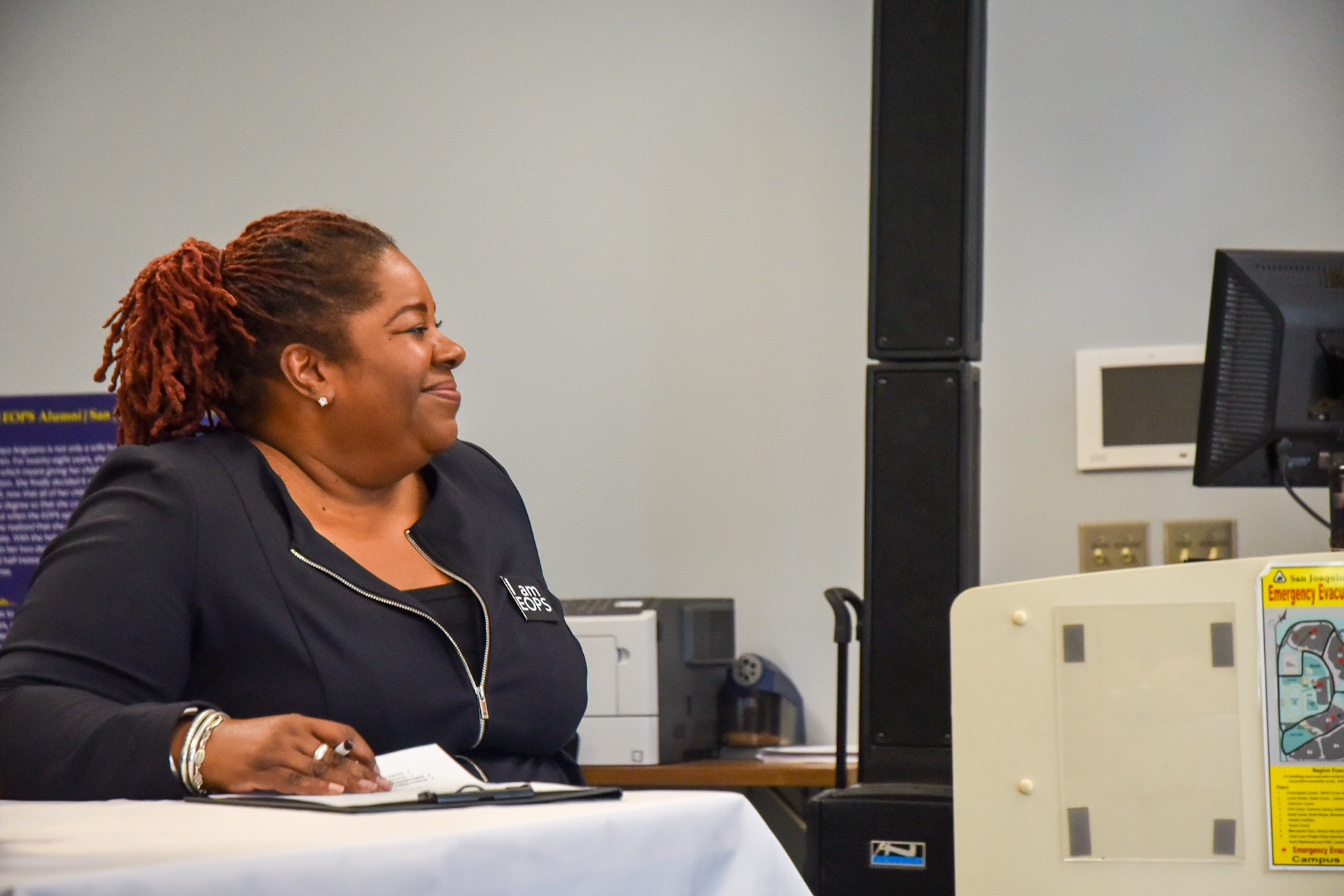 Danita Scott, who directs Delta College's EOPS program, listens as Se'Quoia Drew shares her story at the recent EOPS 50th anniversary celebration.