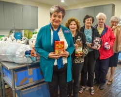 Members of the Native Daughters of the Golden West pose with donations they made to the Student Food Pantry at San Joaquin Delta College.