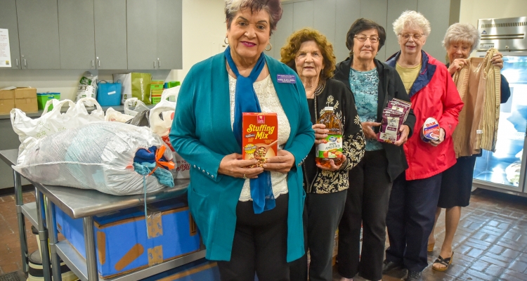 Members of the Native Daughters of the Golden West pose with donations they made to the Student Food Pantry at San Joaquin Delta College.