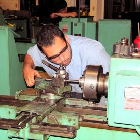 Student operates machinery in Mechanical Tech class